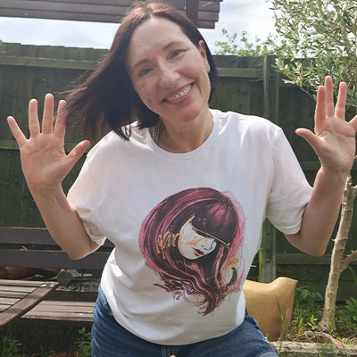 Nicky Priaulx wearing the Crimson Veil graffiti art t-shirt, smiling — no filters, no apologies