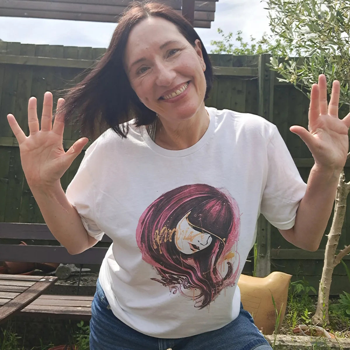 Nicky Priaulx wearing the Crimson Veil graffiti art t-shirt, smiling — no filters, no apologies